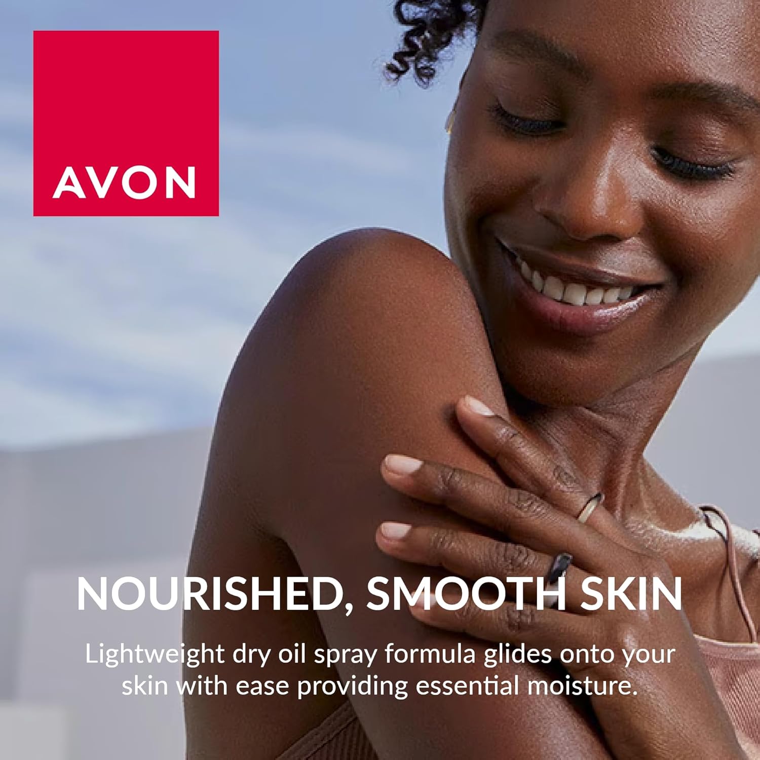 Avon dry oil spray photographed at an angle showing the bottle shape