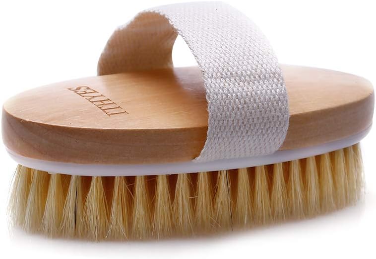 Side profile of the Ithyes body brush showing the wooden body, white plastic base and bristle bed