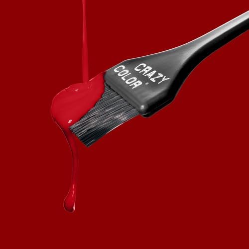 Tint brush loaded with dripping Vermillion Red dye against a deep red background
