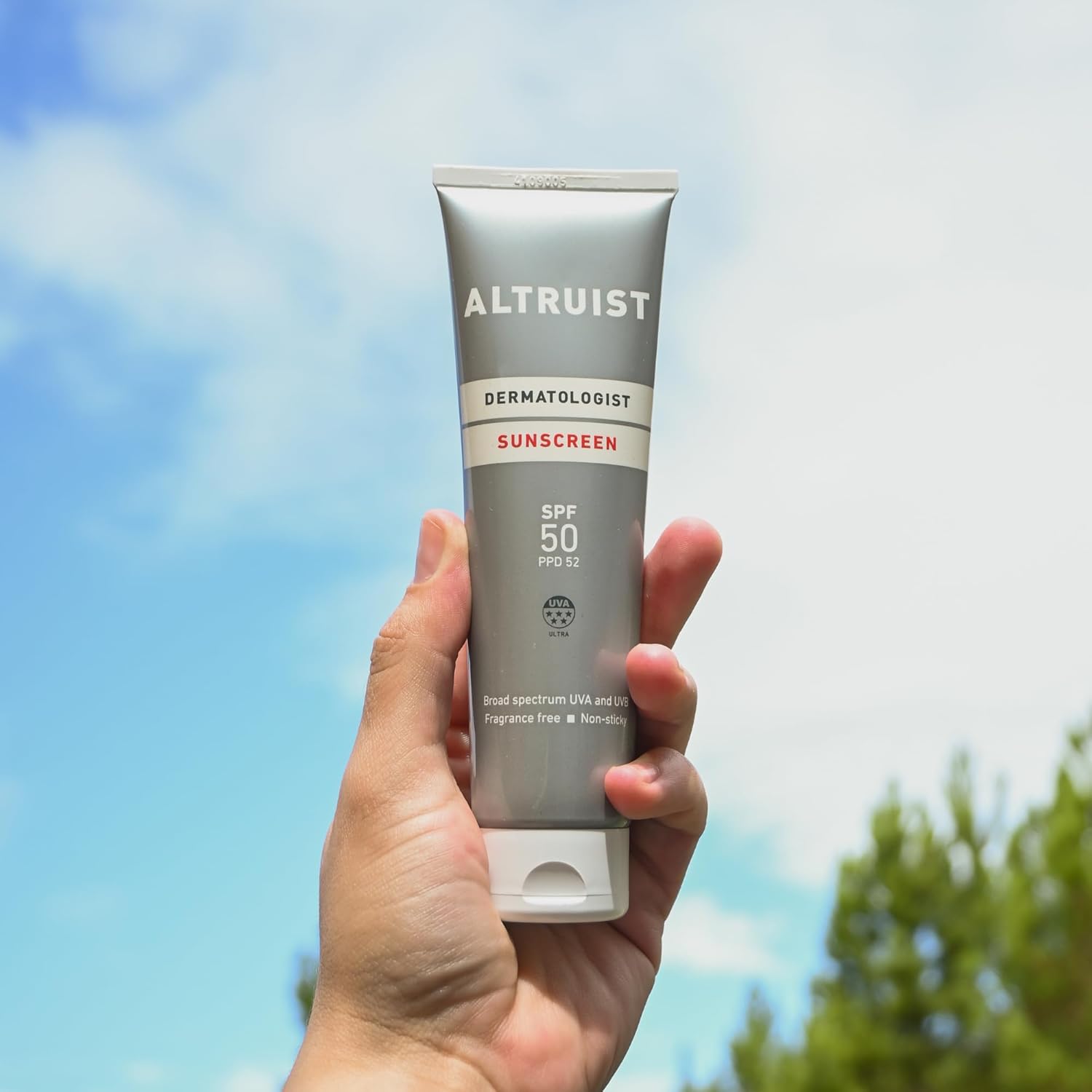 Close-up of thick white sunscreen being rubbed into skin