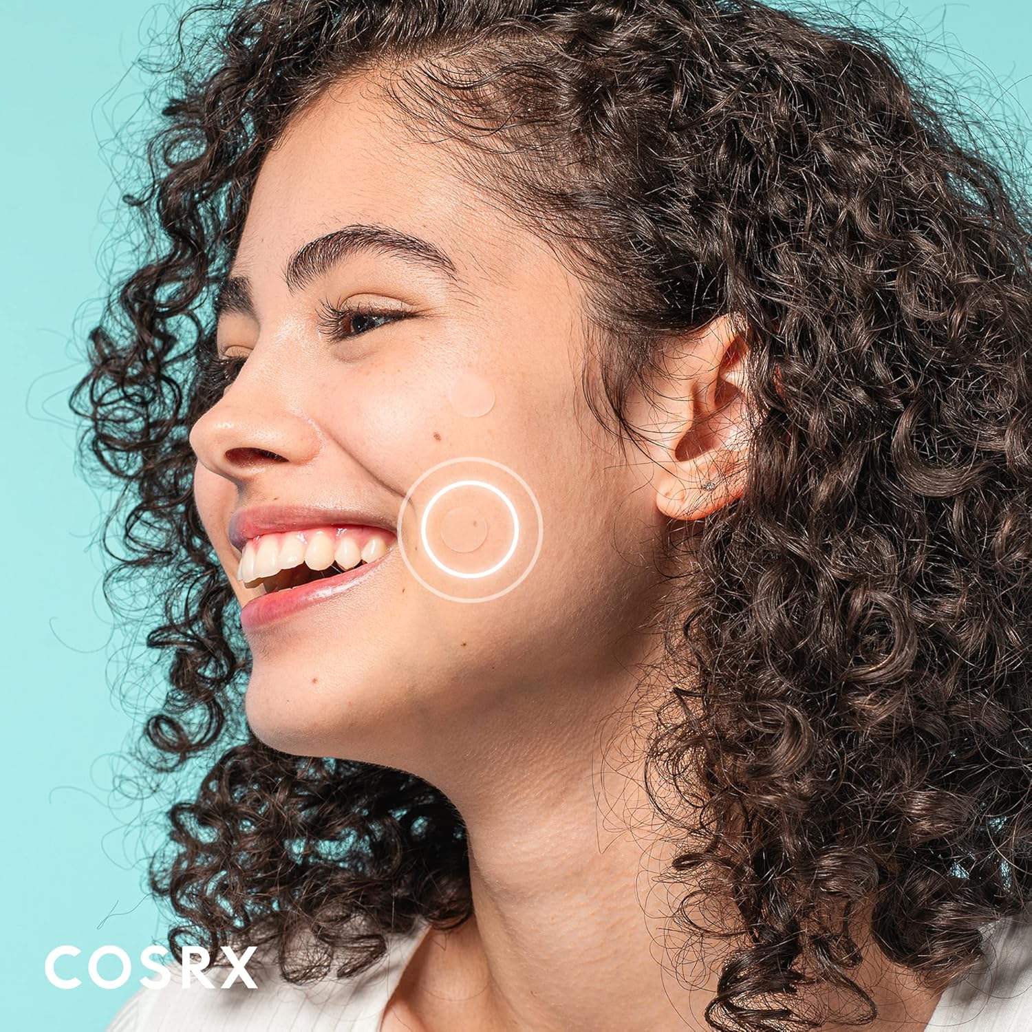 Close-up of a discreet COSRX hydrocolloid patch worn on a smiling model's cheek
