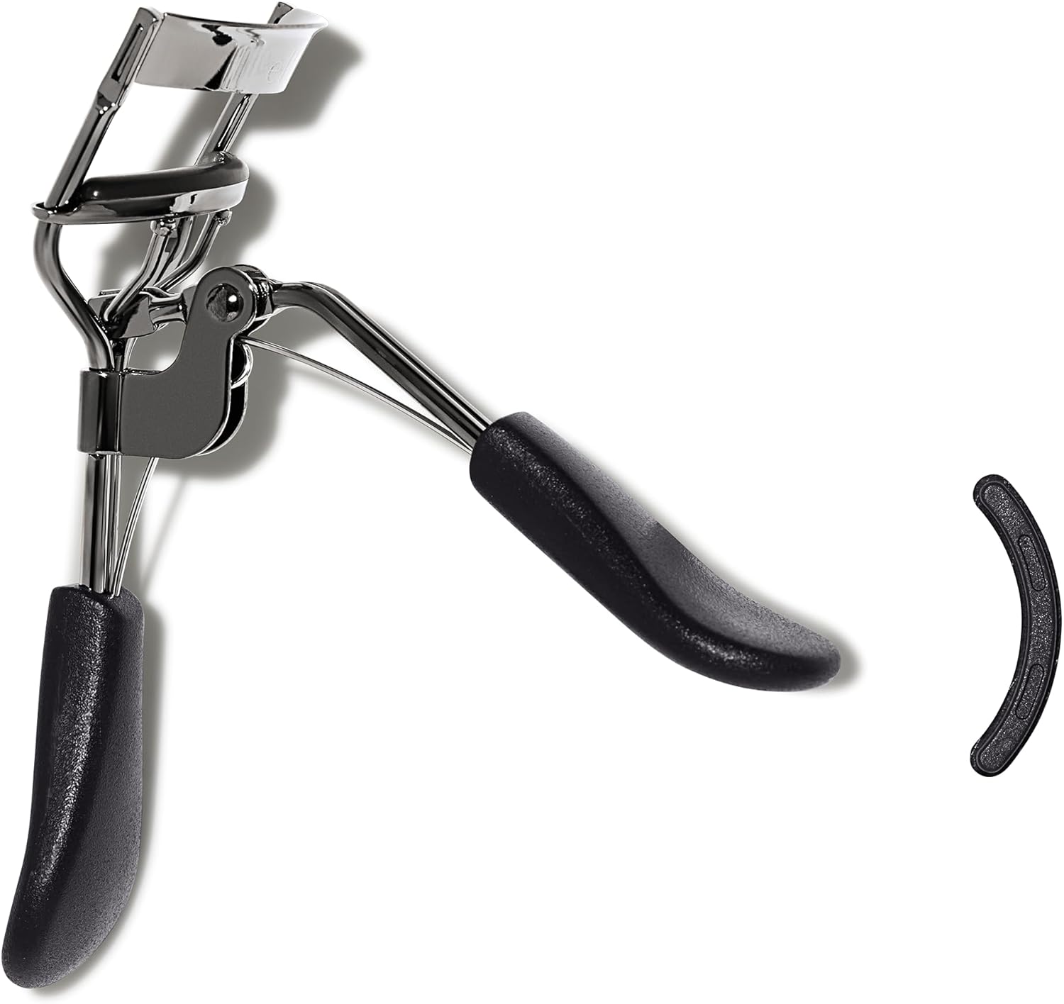 The e.l.f. Pro Eyelash Curler photographed beside the spare curved rubber replacement pad included in the pack