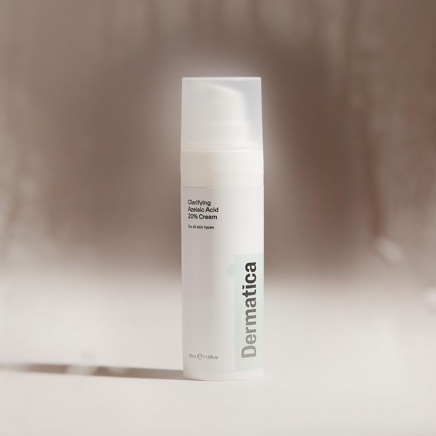 Dermatica Clarifying Azelaic Acid 20% Cream 30 ml pump bottle standing on a plain surface against a soft neutral background