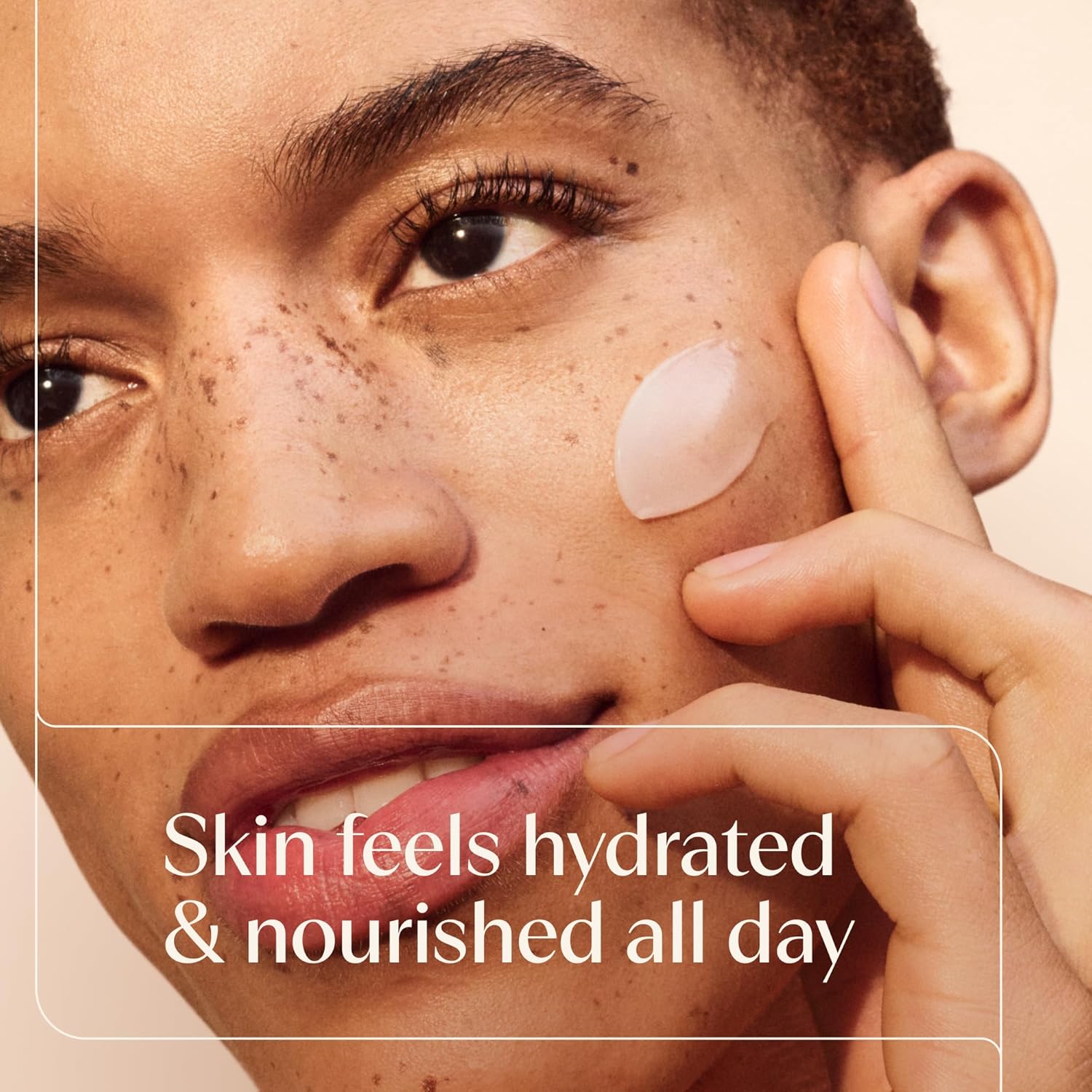 Aveeno Calm+Restore moisturiser applied to freckled facial skin with a small gel dollop visible