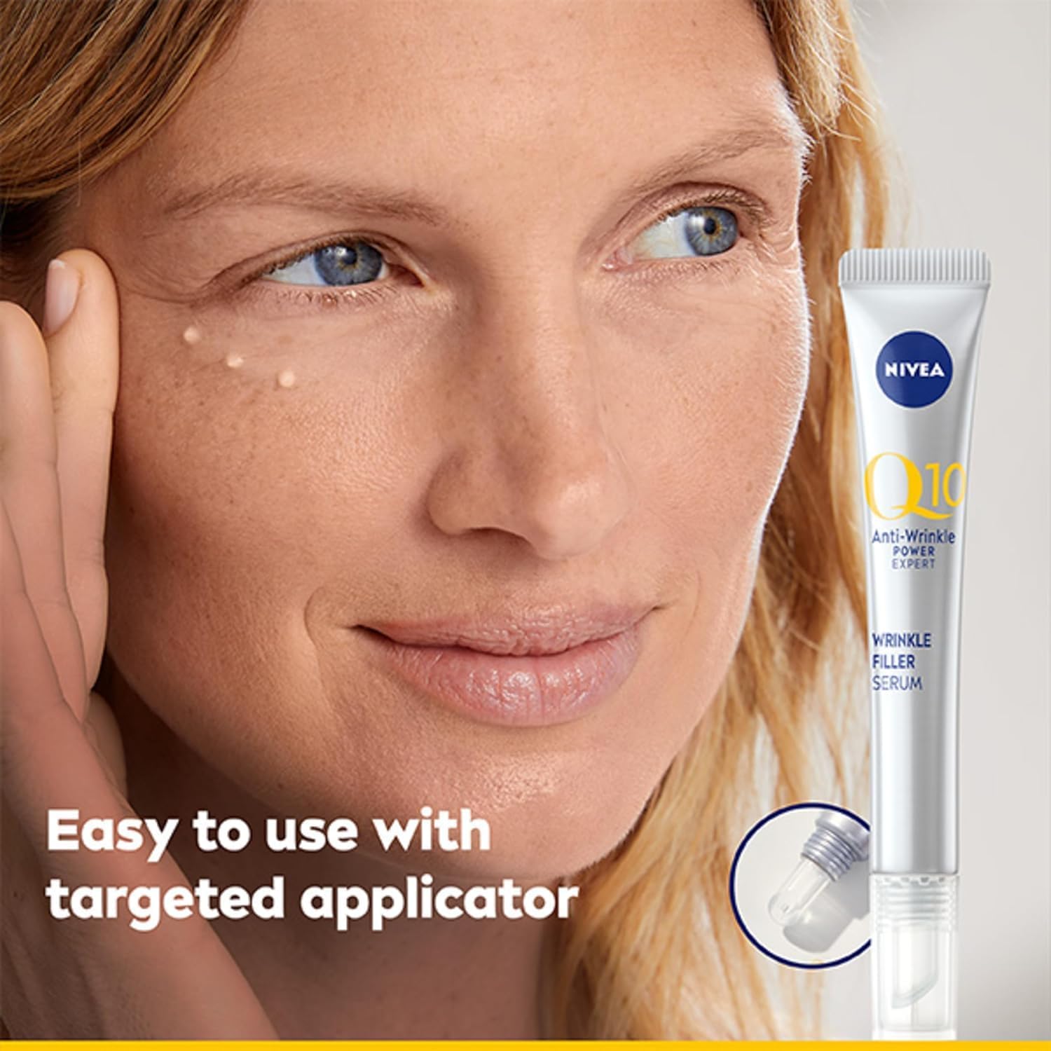 Close-up of woman using NIVEA Q10 serum precision applicator near mouth showing targeted application technique