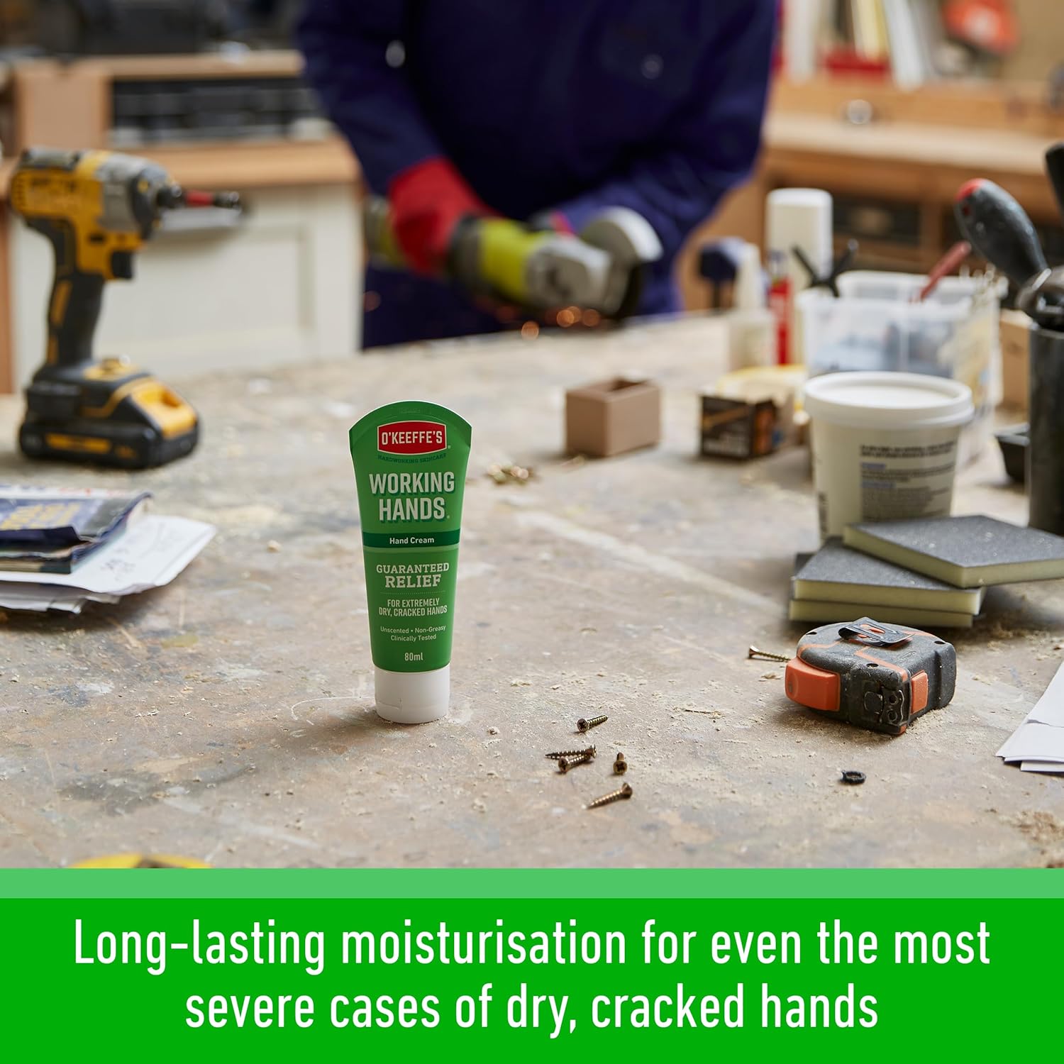 O'Keeffe's Working Hands tube on a workshop bench surrounded by power tools