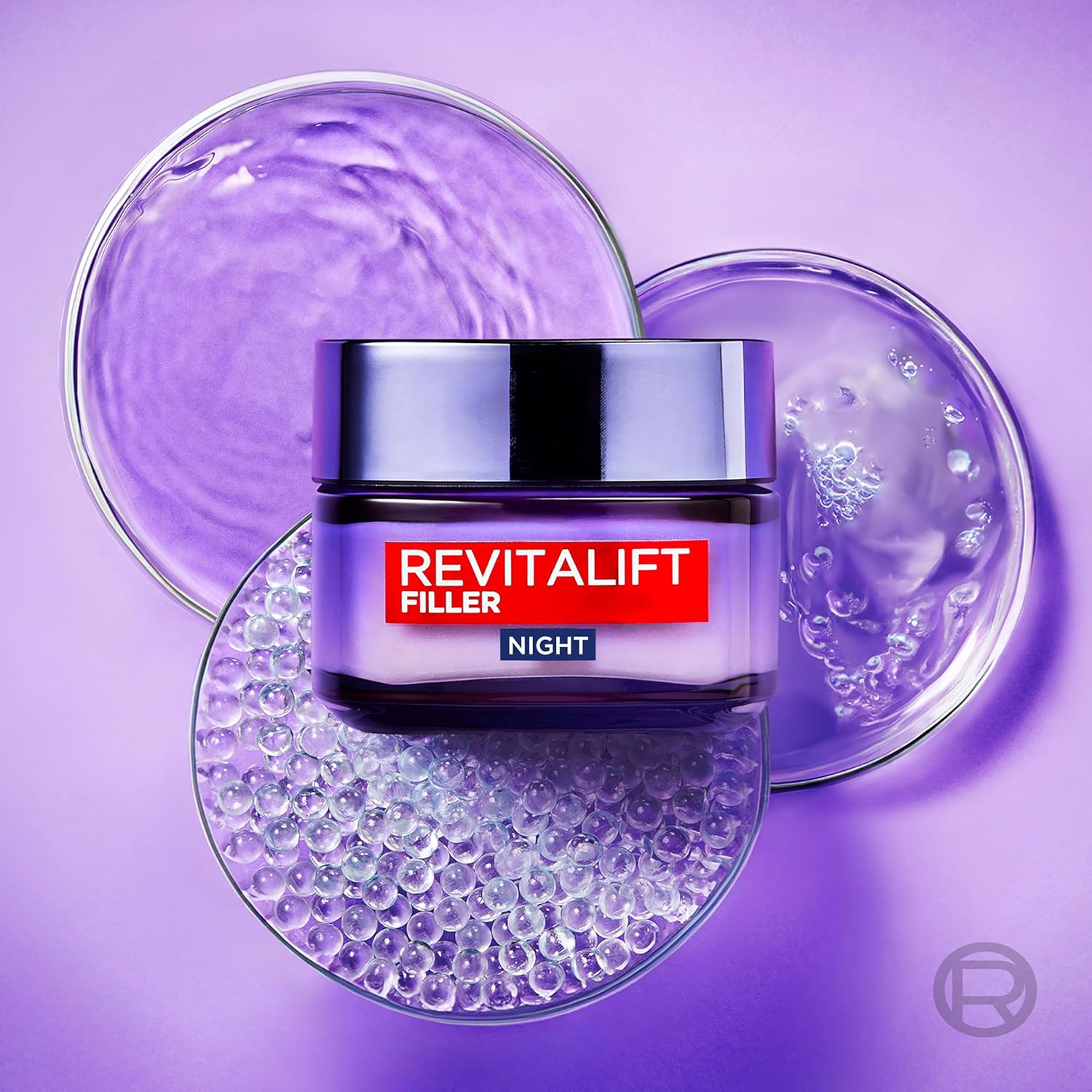 L'Oreal Revitalift Filler Night Cream jar displayed alongside texture samples showing the cream and hyaluronic acid formulation