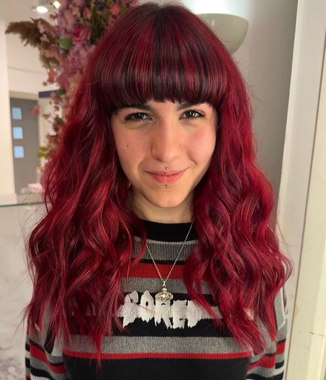 Woman with long wavy deep red hair coloured with Crazy Color Vermillion Red