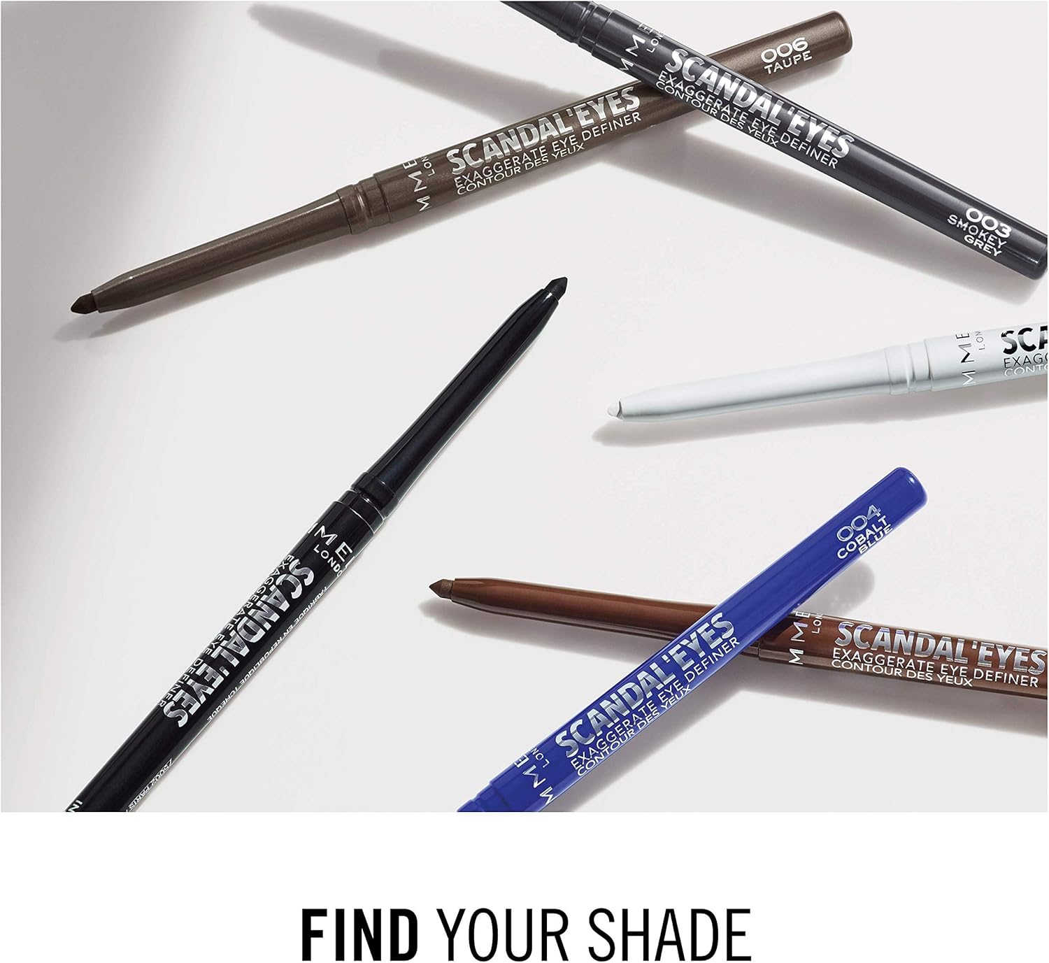 Flat lay of six different Rimmel Scandaleyes Eye Definer pencils showing the full shade range