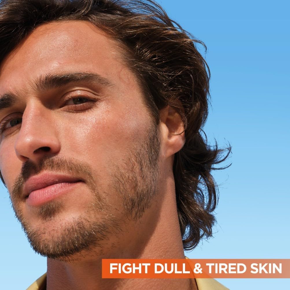 Man with healthy glowing skin alongside text reading Fight Dull and Tired Skin, showing the serum is suitable for all genders