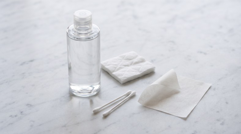 Micellar water, cotton pad, cotton buds and blotting paper for fixing foundation that has already separated