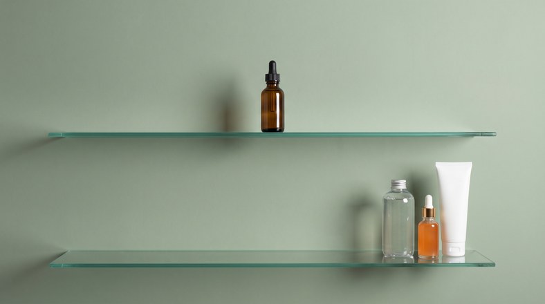 Retinol serum kept on a separate shelf from exfoliating acid toner and vitamin C to avoid layering clashes