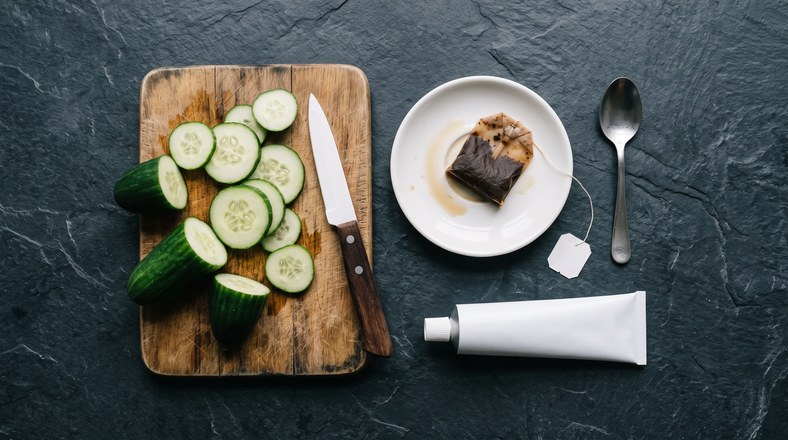 Cucumber slices, tea bag and cream compared as puffy eye remedies that mostly rely on cold