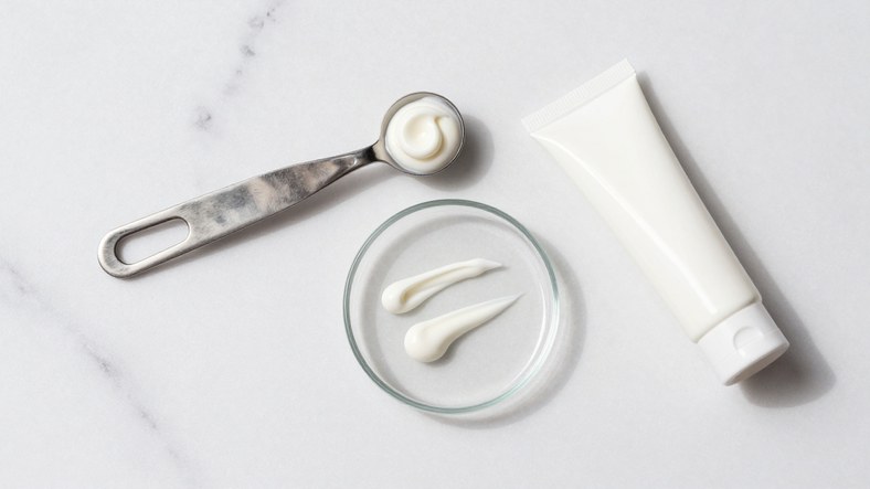 Sunscreen dose measured out on marble showing how much to apply to avoid a white cast without losing protection